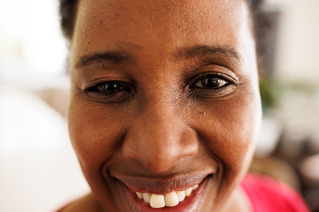 A senior woman sharing a warm, confident smile